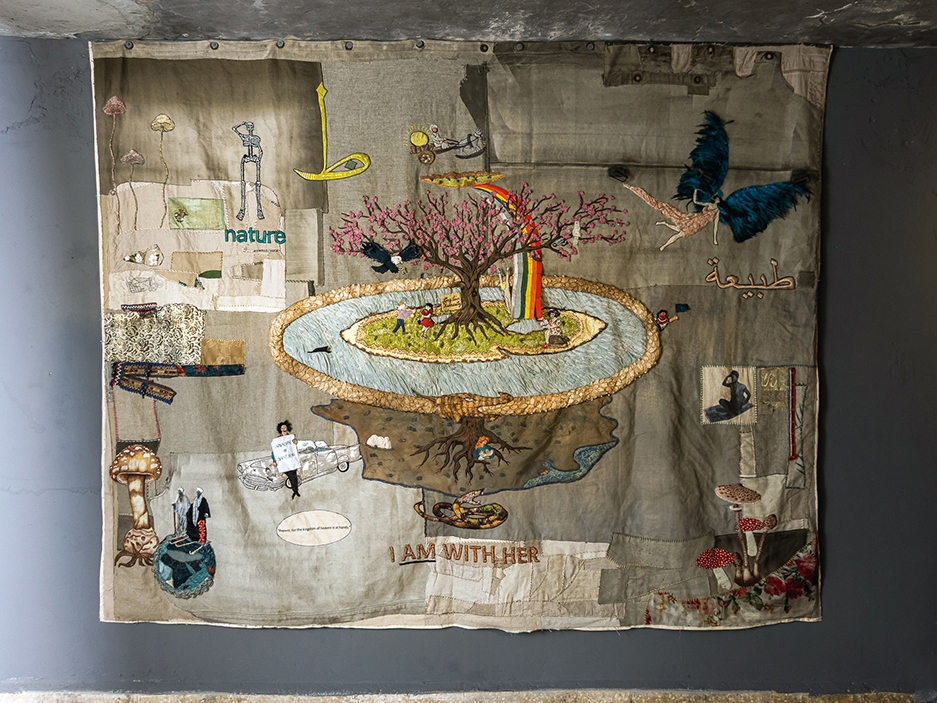 Lara Baladi, ‘I AM WITH HER,’ from the series, ‘The River of Life.’ 

Lara Baladi in collaboration with Bokja Design – Huda Baroudi and Maria Hibri.

Embroidery and appliqués on mixed textiles based on a photomontage by Lara Baladi. 260X210CM. Beirut, Lebanon, 2021.