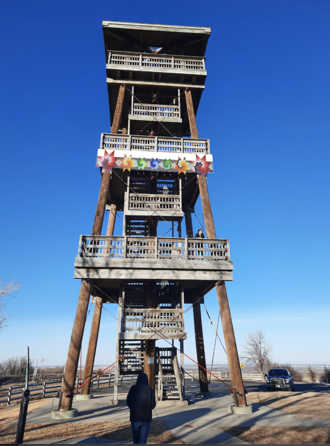 A mock-up of “Wičaȟnpi” on the Nicollet Tower in South Dakota (photo and edit by Erin Genia)